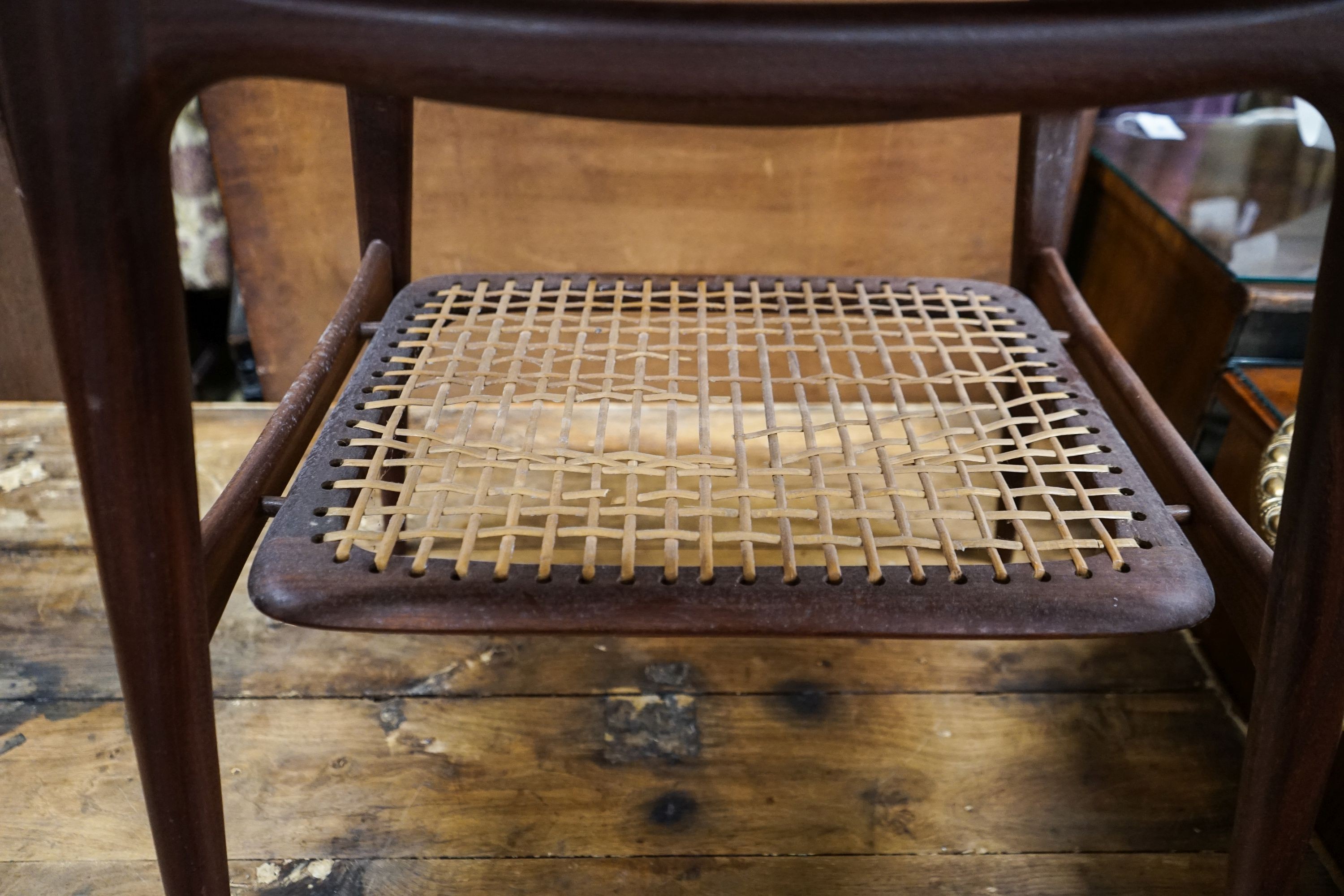 A Dutch 1950's 'Webe' rectangular teak occasional table attributed to Louis Van Teefellelen, with rattan undertier on plain tapered legs (label to underside), width 64cm, depth 49cm, height 63cm